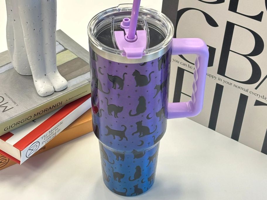 purple and black Ashland 40oz Iridescent Cat Stainless Steel Insulated Tumbler on desk