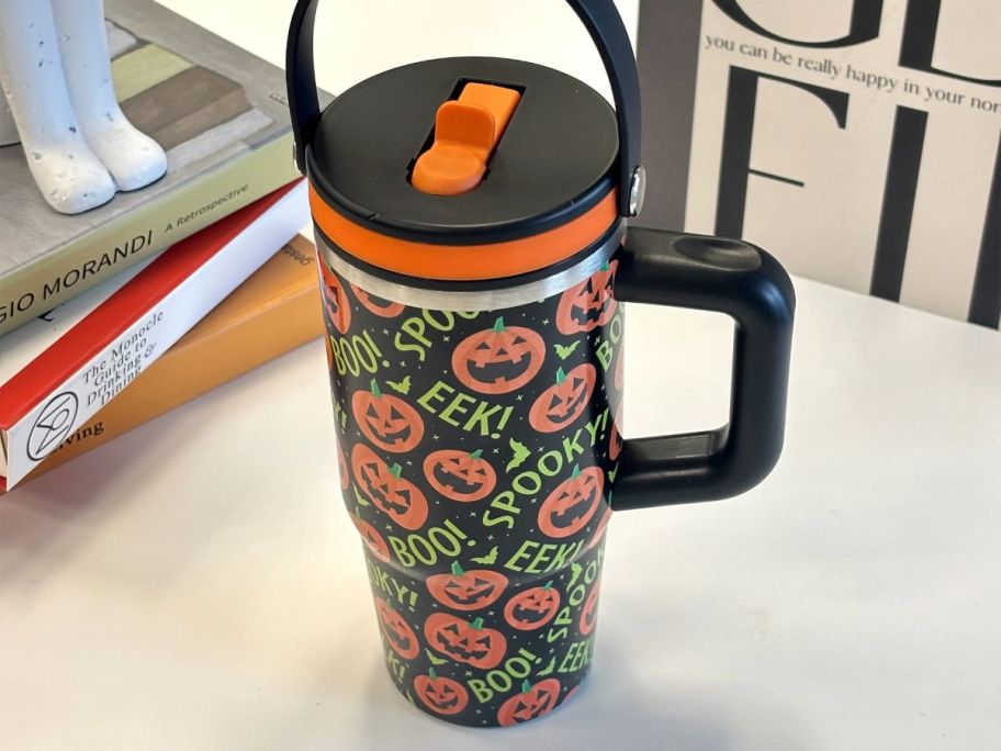 black, orange, and green Ashland 20oz Jack-O'-Lantern Stainless Steel Insulated Tumbler on desk
