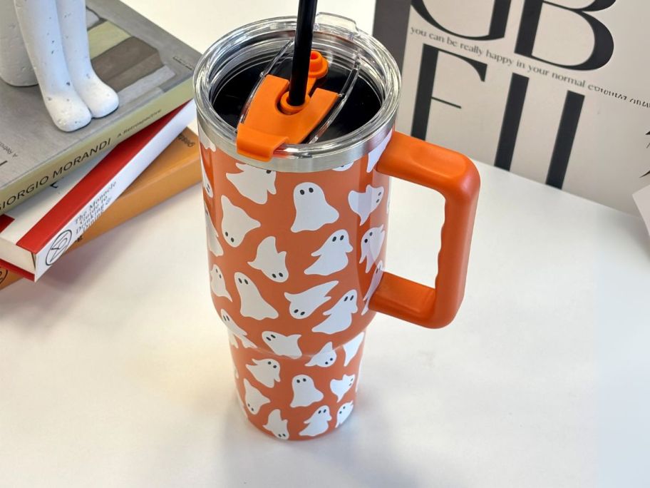 orange and white Ashland 40oz Ghost Stainless Steel Insulated Tumbler on desk
