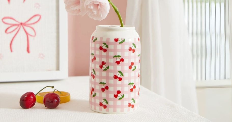 Mainstays Pink Gingham Cherry Soda Can Ceramic Vase on table with flowers in it
