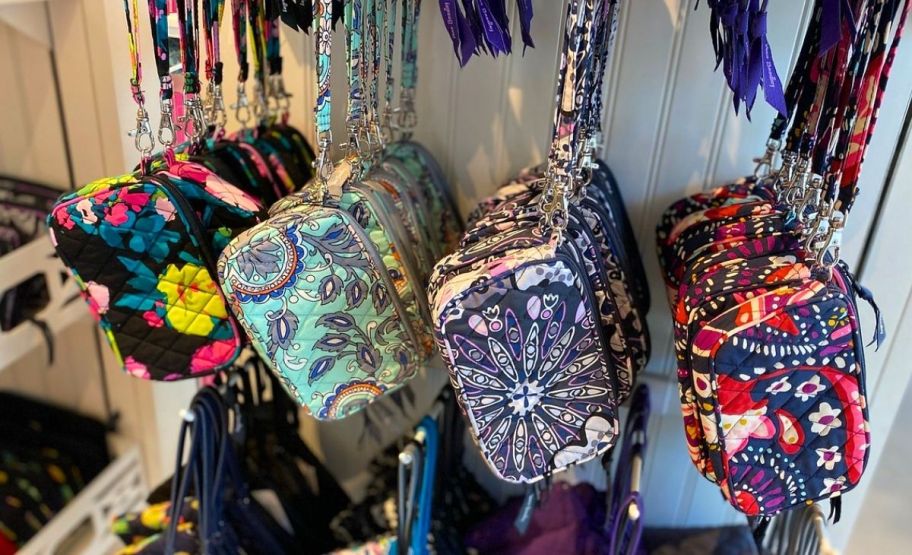 4 vera bradley wristlets hanging on a store display