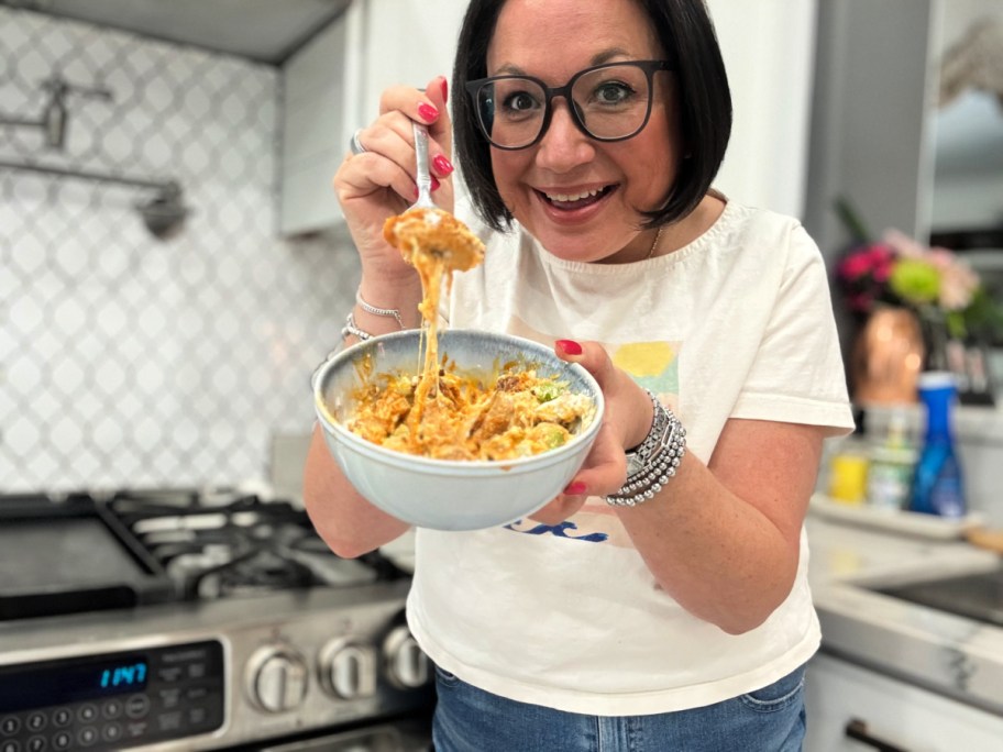 woman eating a buffalo chicken cottage cheese bowl