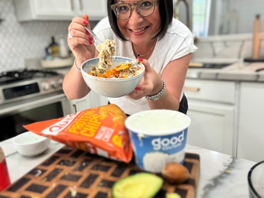 woman holding a taco cottage cheese bowl 