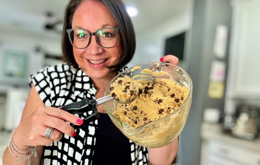 woman holding an ice cream scoop for cookie dough (1)