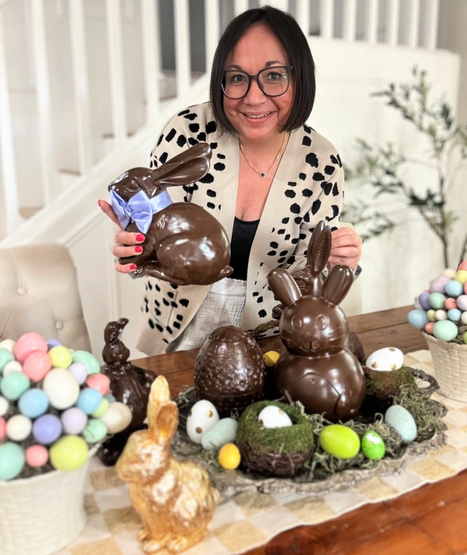 woman with chocolate painted easter decor on a dining table