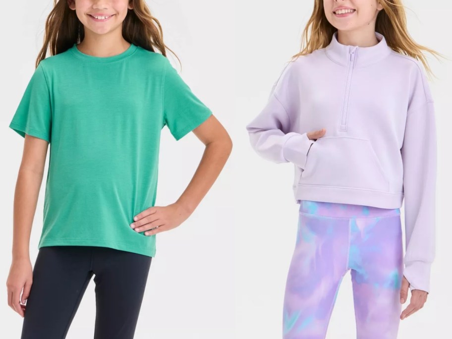 girl wearing a green tshirt and black leggings and girl wearing a light purple pullover sweatshirt and colorful leggings