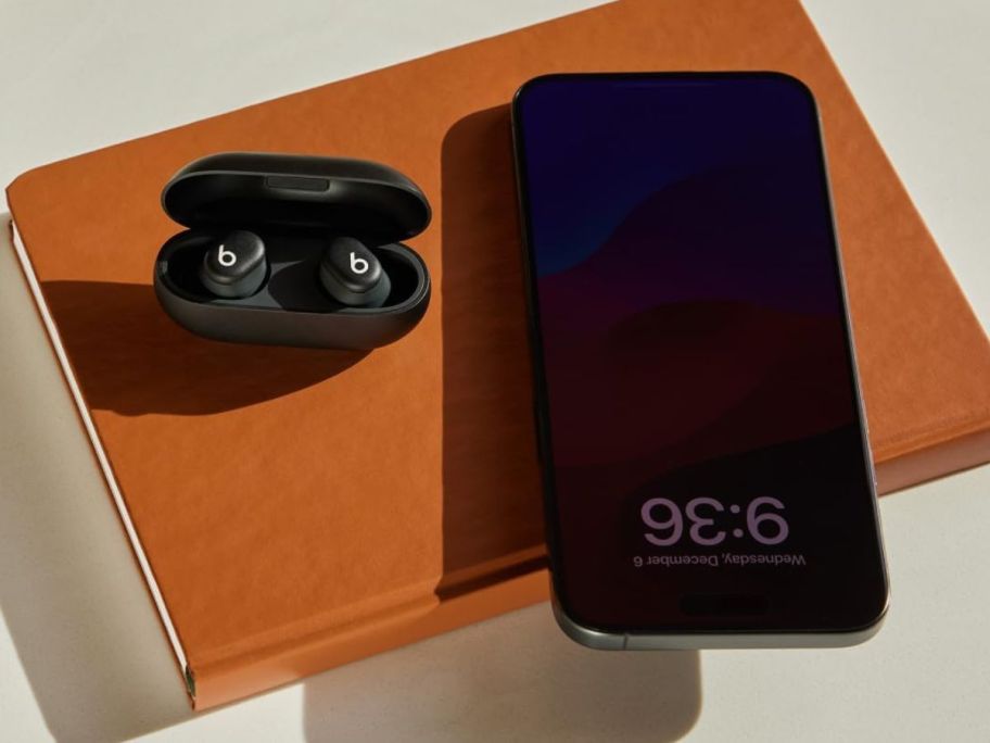 Beats solo buds next to a phone