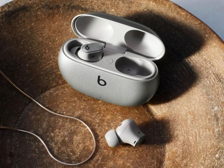 Beats Studio Buds+ in a wooden bowl