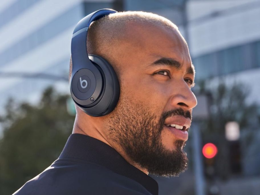 Man wearing black Beats Studio Pro Wireless Bluetooth Noise Cancelling Headphones