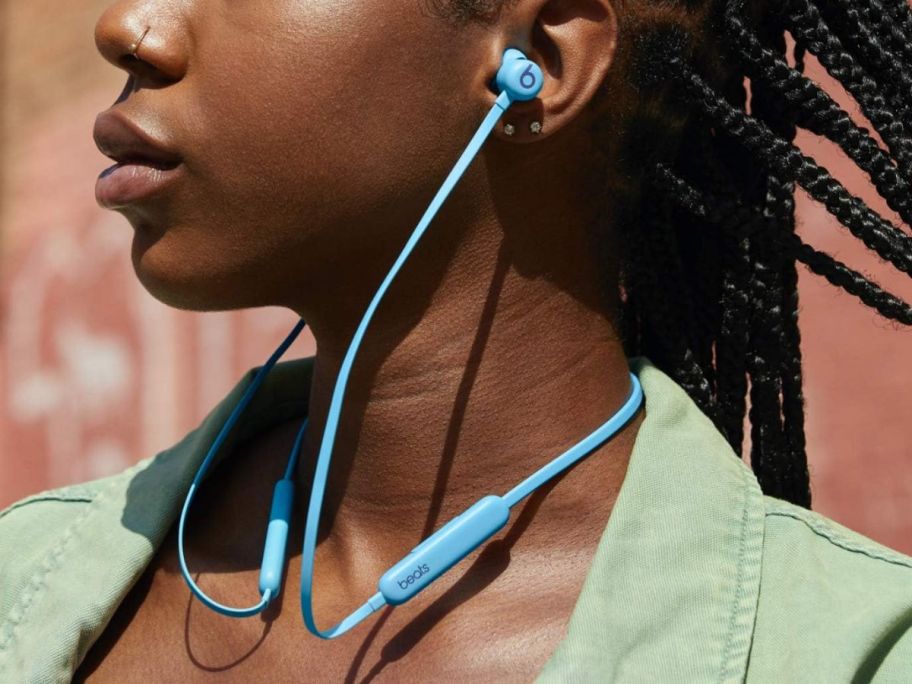 Woman wearing Beats Flex Wireless Earbuds