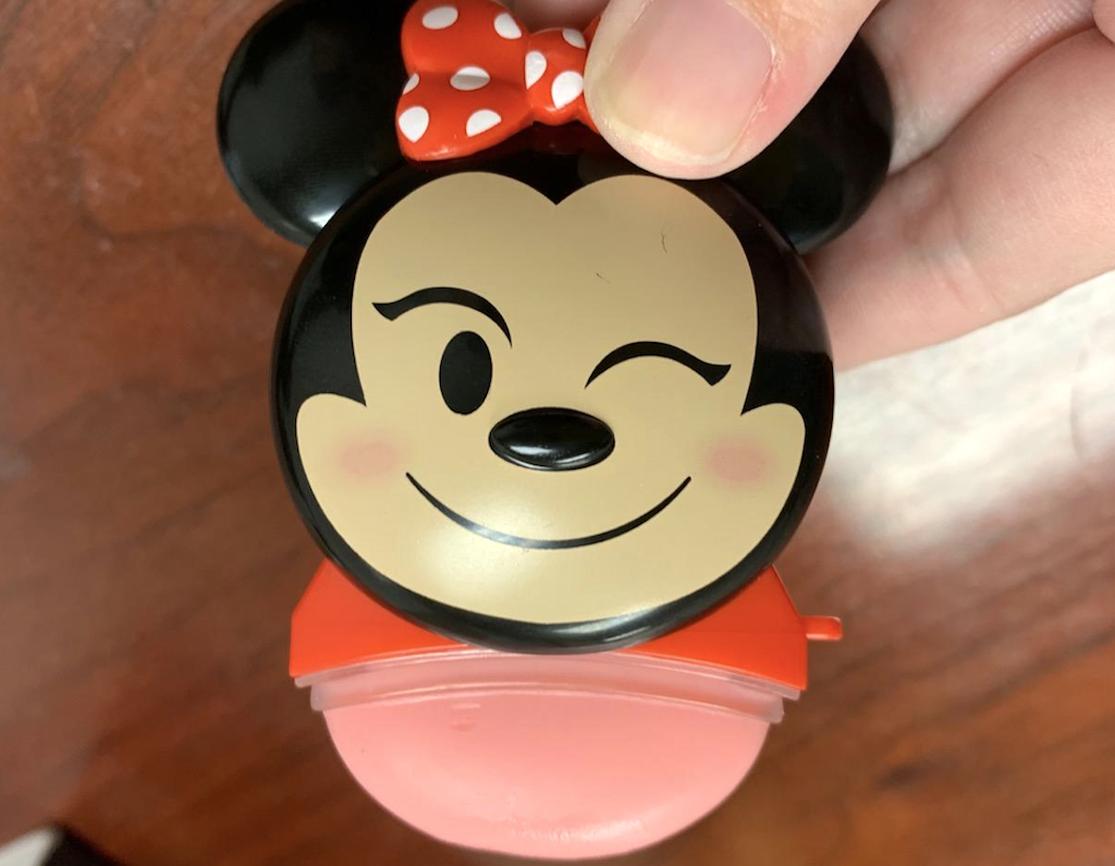 holding Disney Minnie Mouse lip