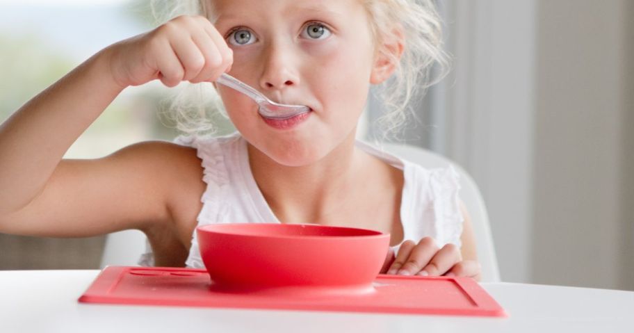 little girl eating from an EZPZ The Happy Bowl