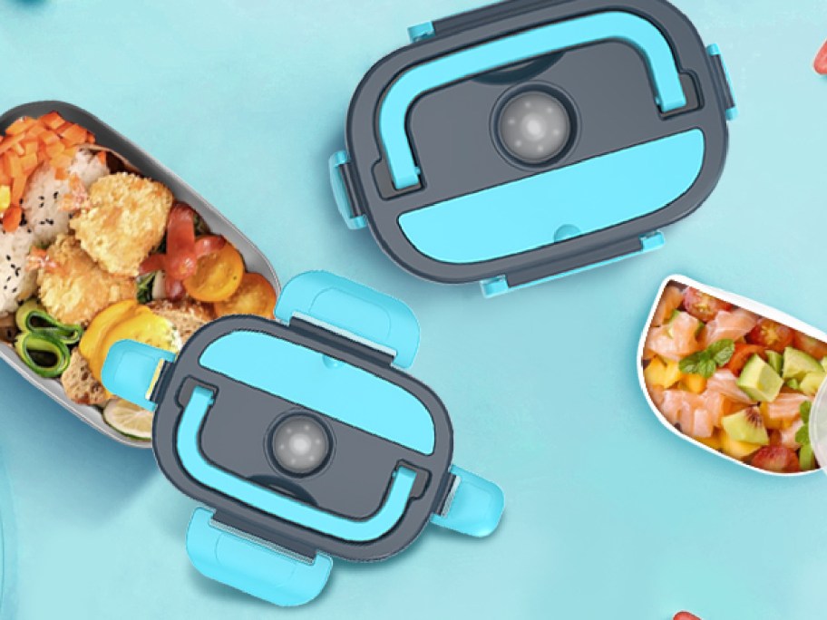 Electric Heated Lunch Box displayed opened on top of a blue table