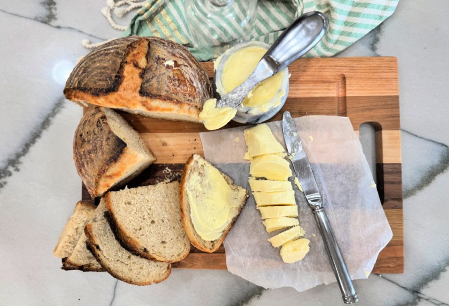 cutting board with sourdough and homemade butter 