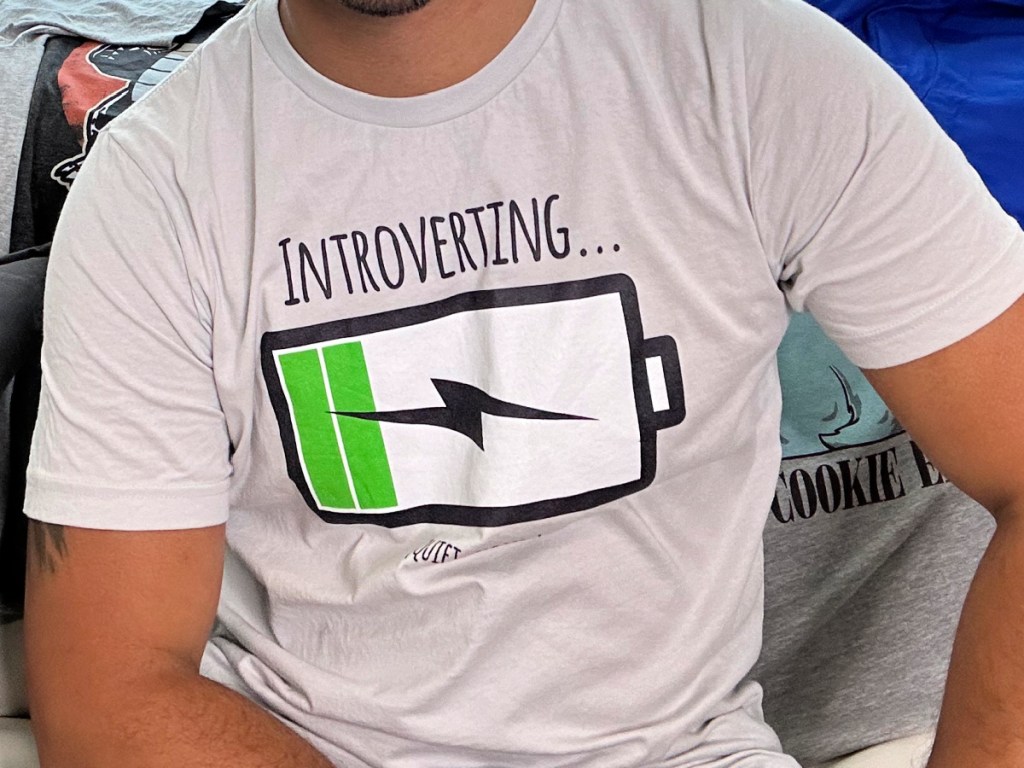 man wearing gray introverted tee with battery on low charge