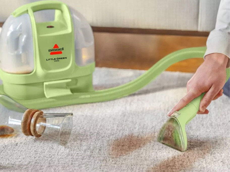 Little Green Mini being used to clean a carpet