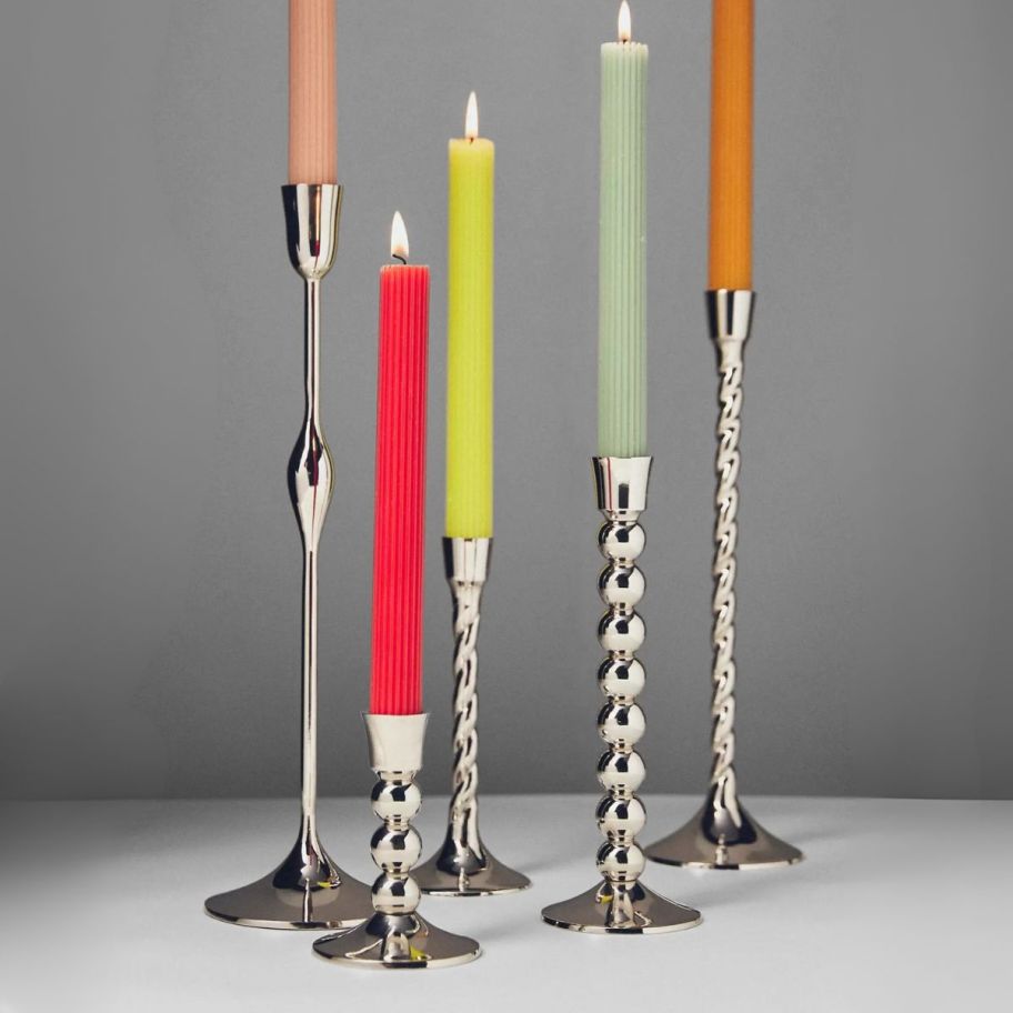 silver taper candle holders in various sizes