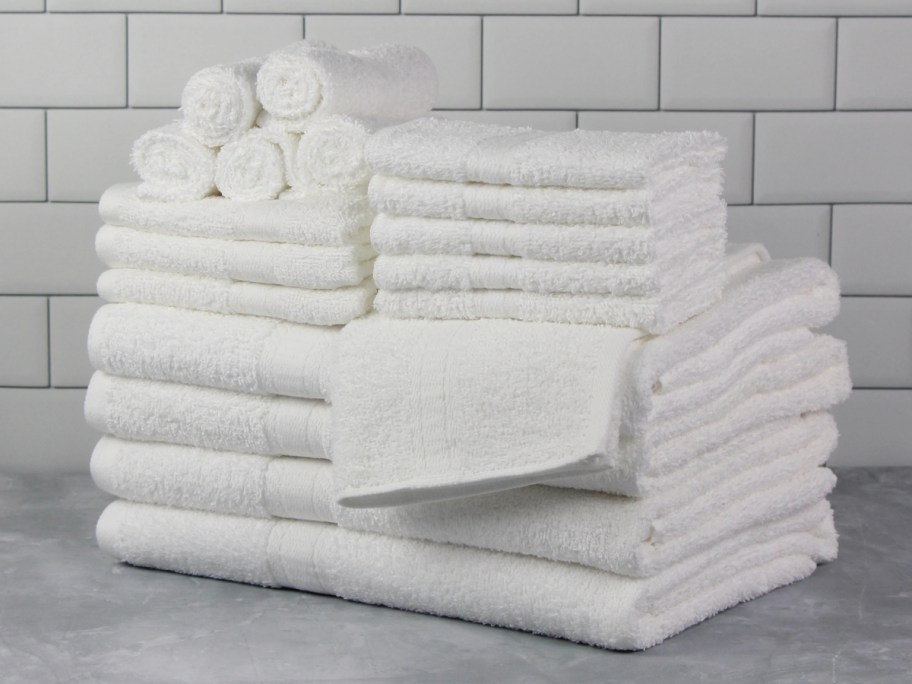 18-piece mainstays towel set in white folded in stack on counter