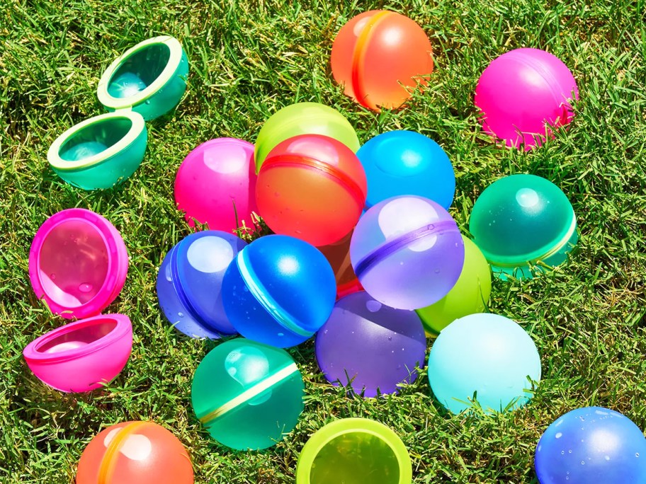 colorful reusable water balloons on grass
