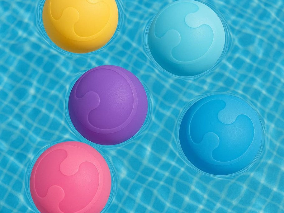 colorful Resuable Water Balloons floating in a pool