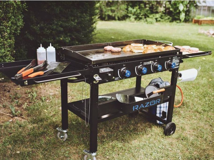 Razor 37" 4-Burner Portable Gas Griddle with food and accessories on it
