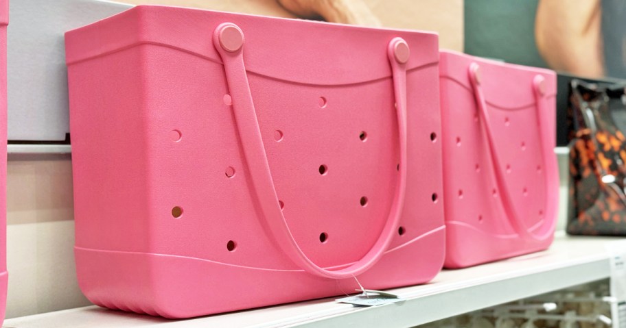 pink tote bags with holes on store shelf