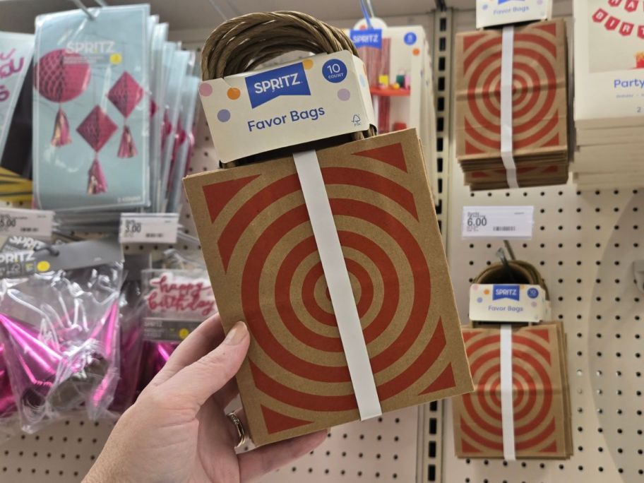 Hand holding a Spritz Target Mini Checkout Treat Bag 10-Count