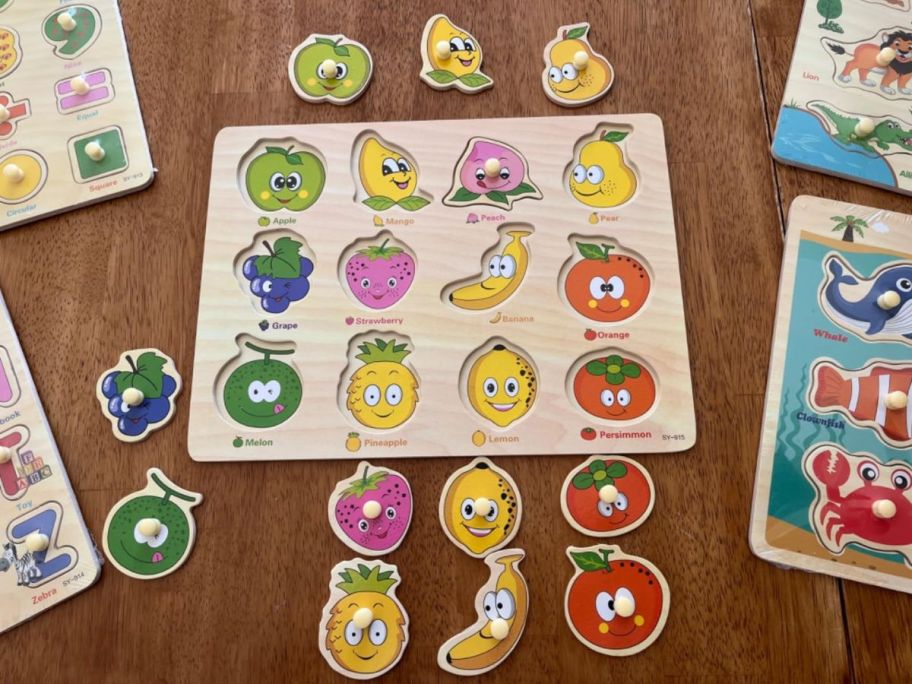 A wooden peg puzzle for toddlers with fruit