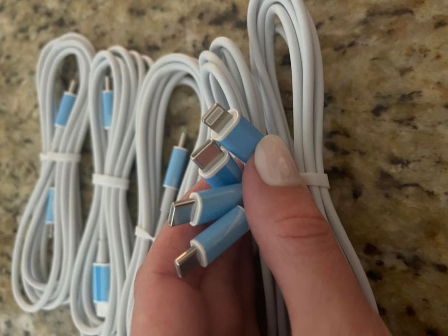 A person holding a USB-C Charging Cable