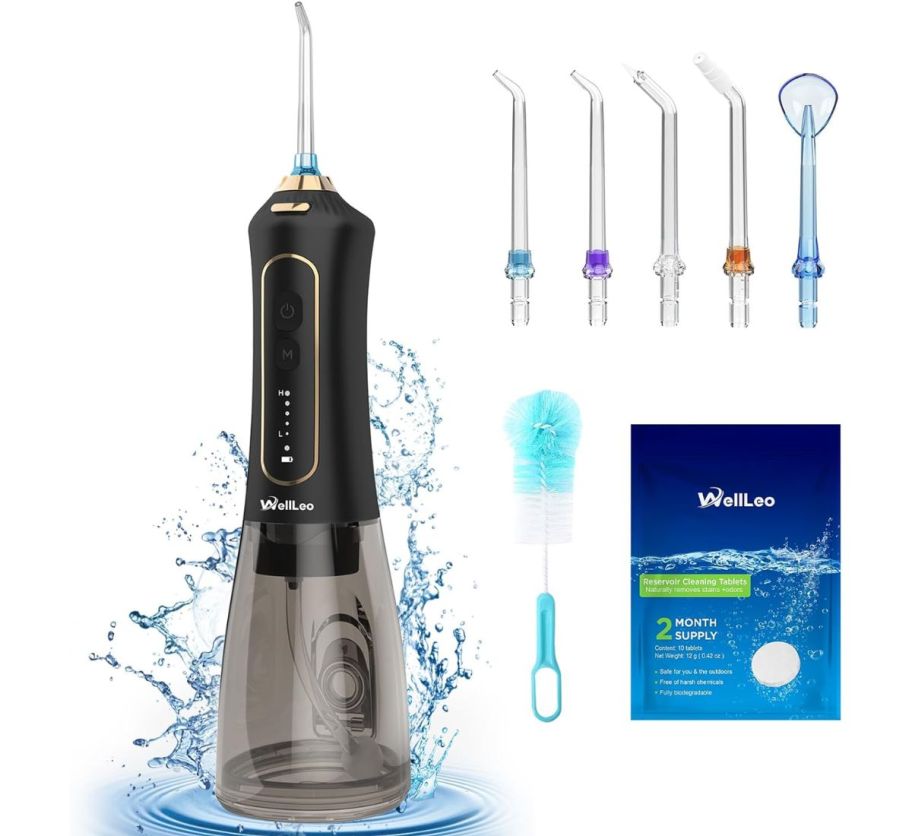 a black water flosser shown with accessories