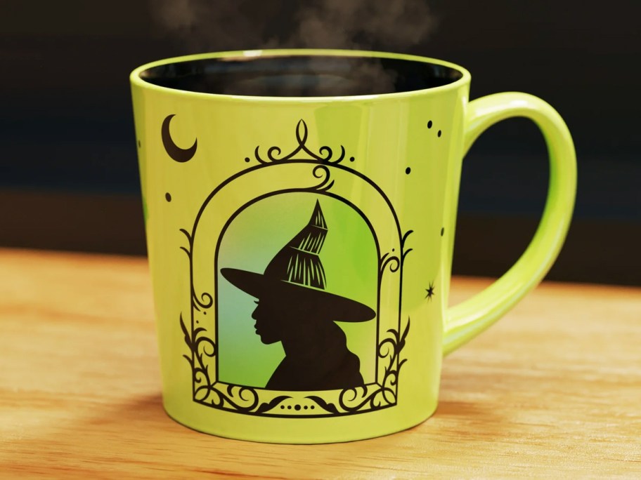 green wicked mug on wood table