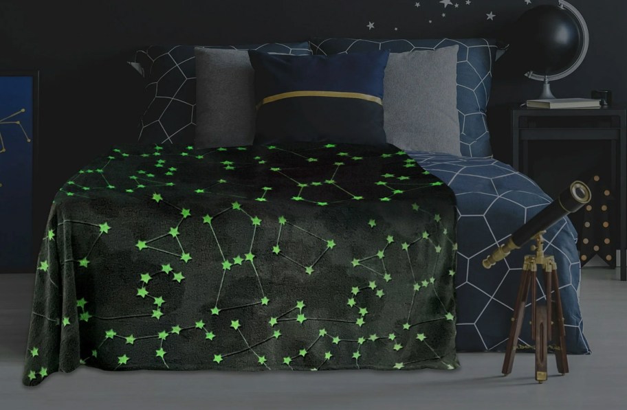 glow in the dark grey constellation print throw blanket on bed