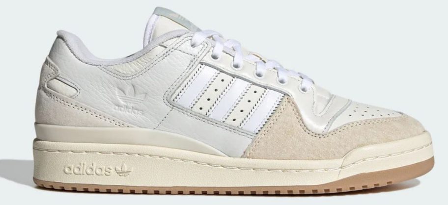 beige and white adidas Men's Forum 84 Low Adv Shoe stock image