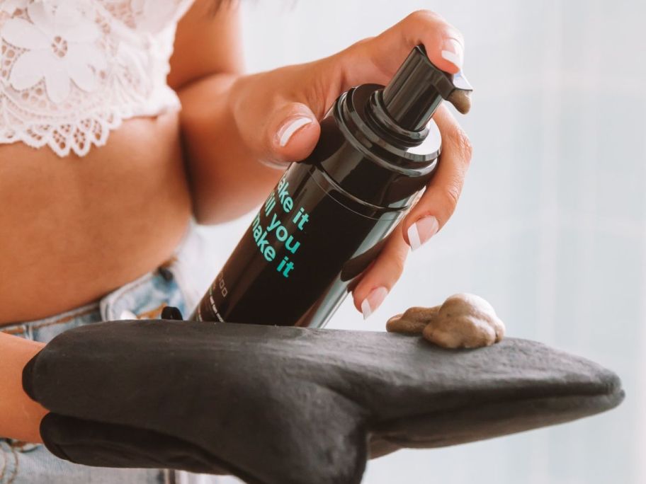 Hand pumping b.Tan fake it6 till you make it tanning mouse onto a mitt