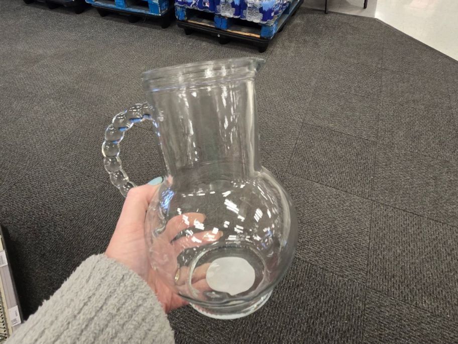 Glass Pitcher in hand in store