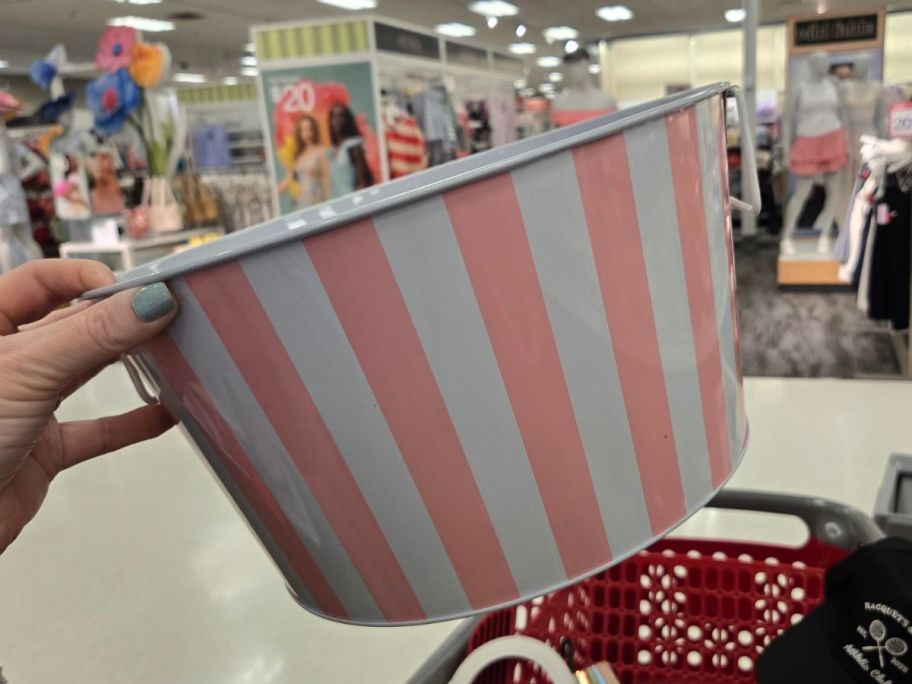 pink and white striped Beverage Bucket in hand in store