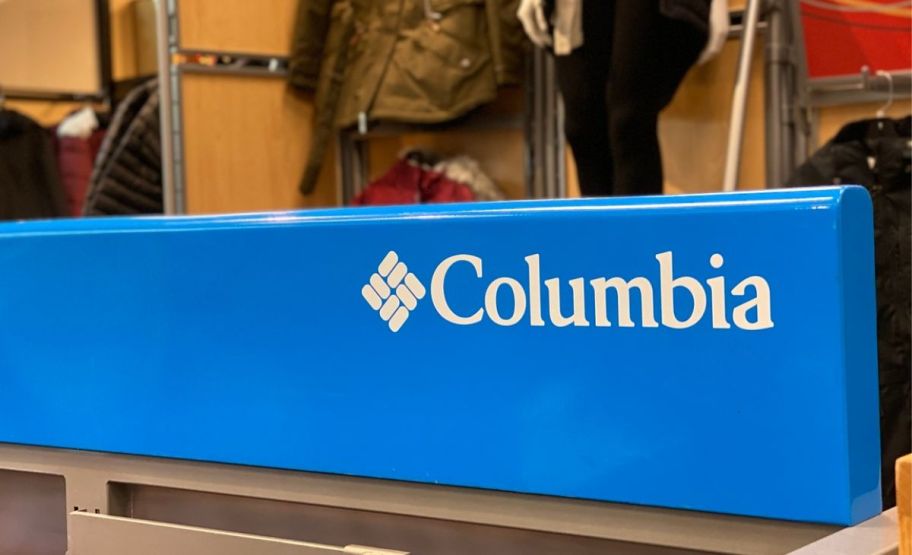 columbia sign on top of a clothing rack