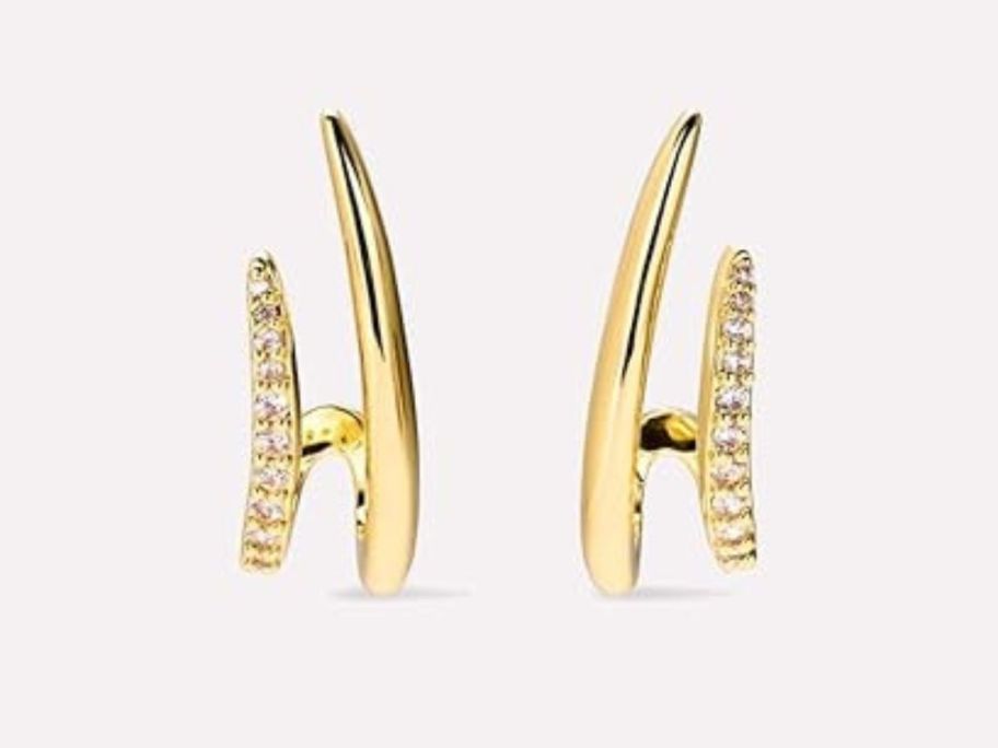 Mumreues 14K Gold Earrings against beige background