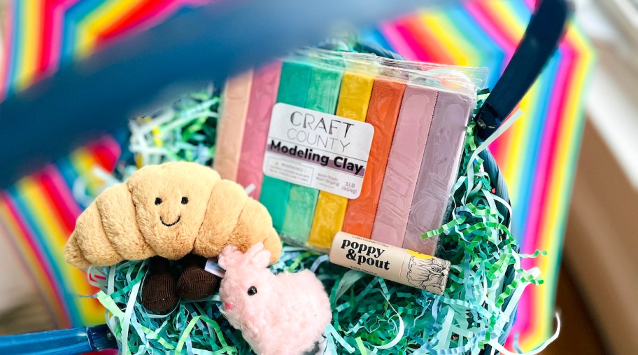 easter basket with stuffies and modeling clay and lip balm