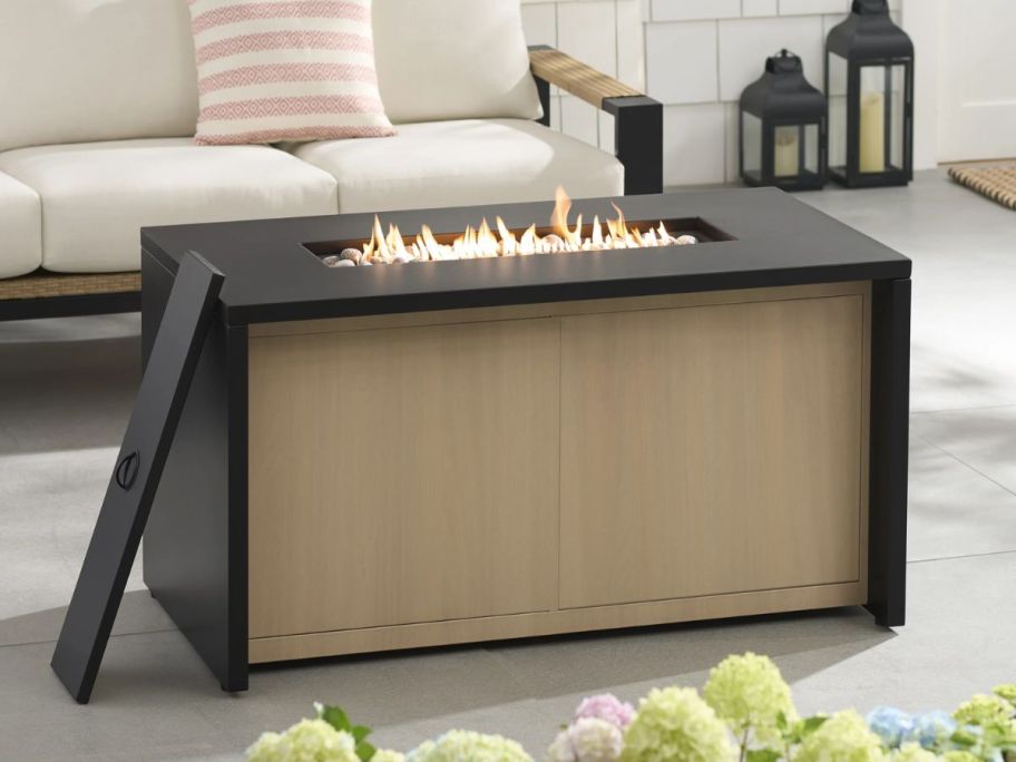 Better Homes & Gardens Ventura Metal Fire Pit on patio