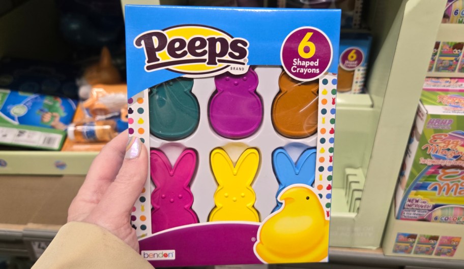 hand holding peeps crayon in an assortment of colors