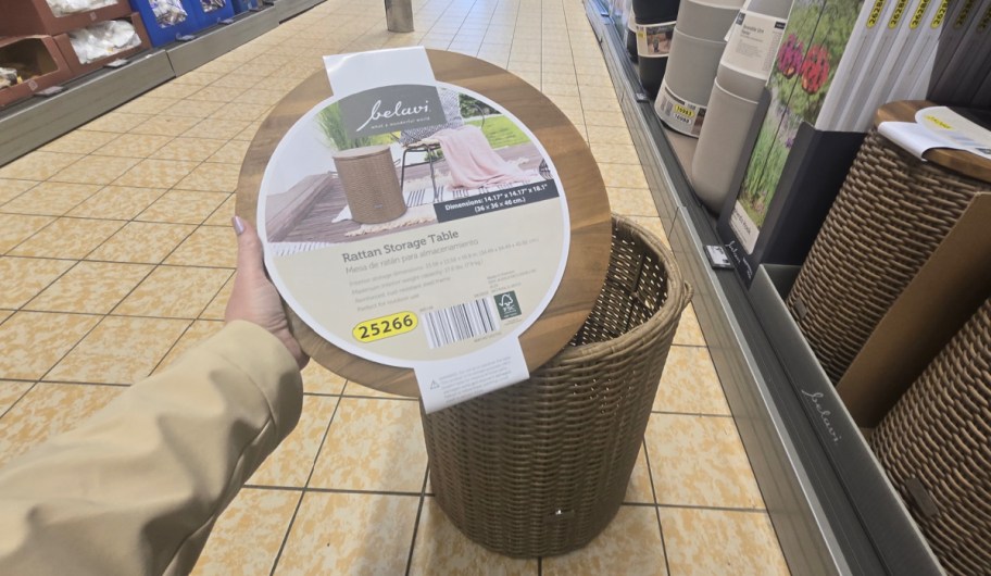 hand holding the lid of Belavi Rattan Storage Round Table