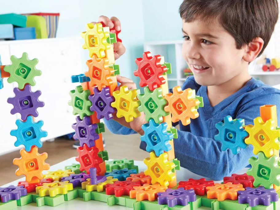 boy playing with gears toys