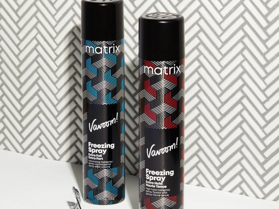 two bottles of matrix hair spray