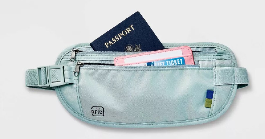 blue open story rfid waist pouch with passport showing