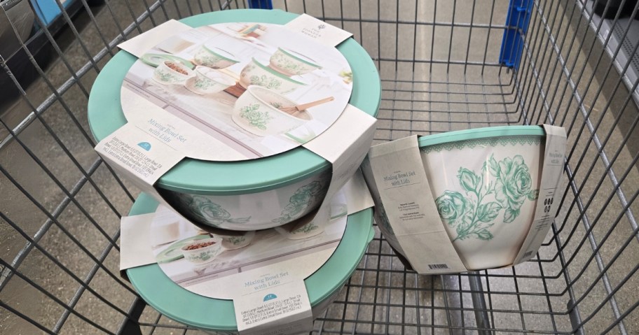 3 sets of green and white floral nesting mixing bowls in a Walmart Cart