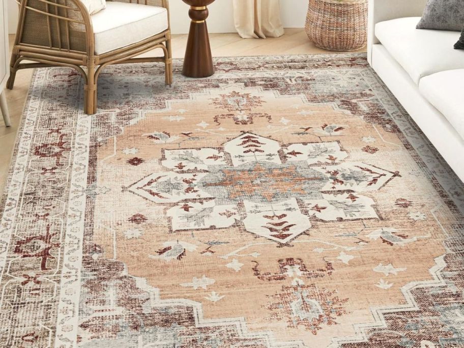 orange and beige printed rug in living room