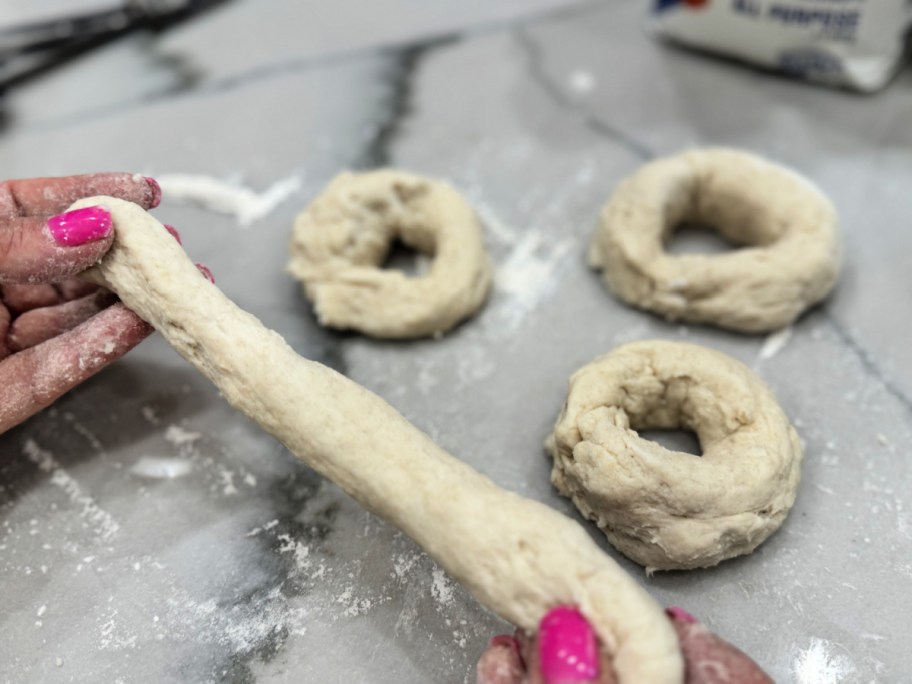 shaping bagels out of cottage cheese and flour