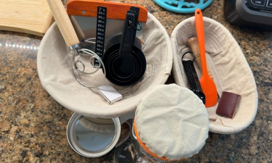 items included in the sourdough starter kit on a kitchen counter