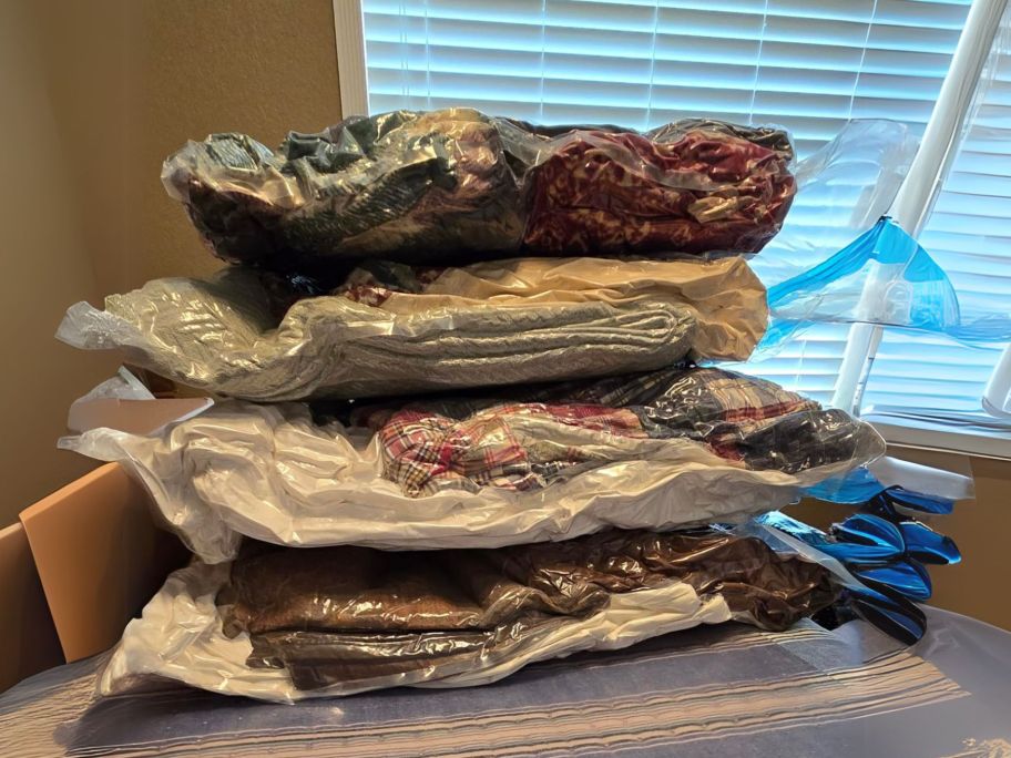 Vacuum Storage Bags filled with clothes stacked on top of each other